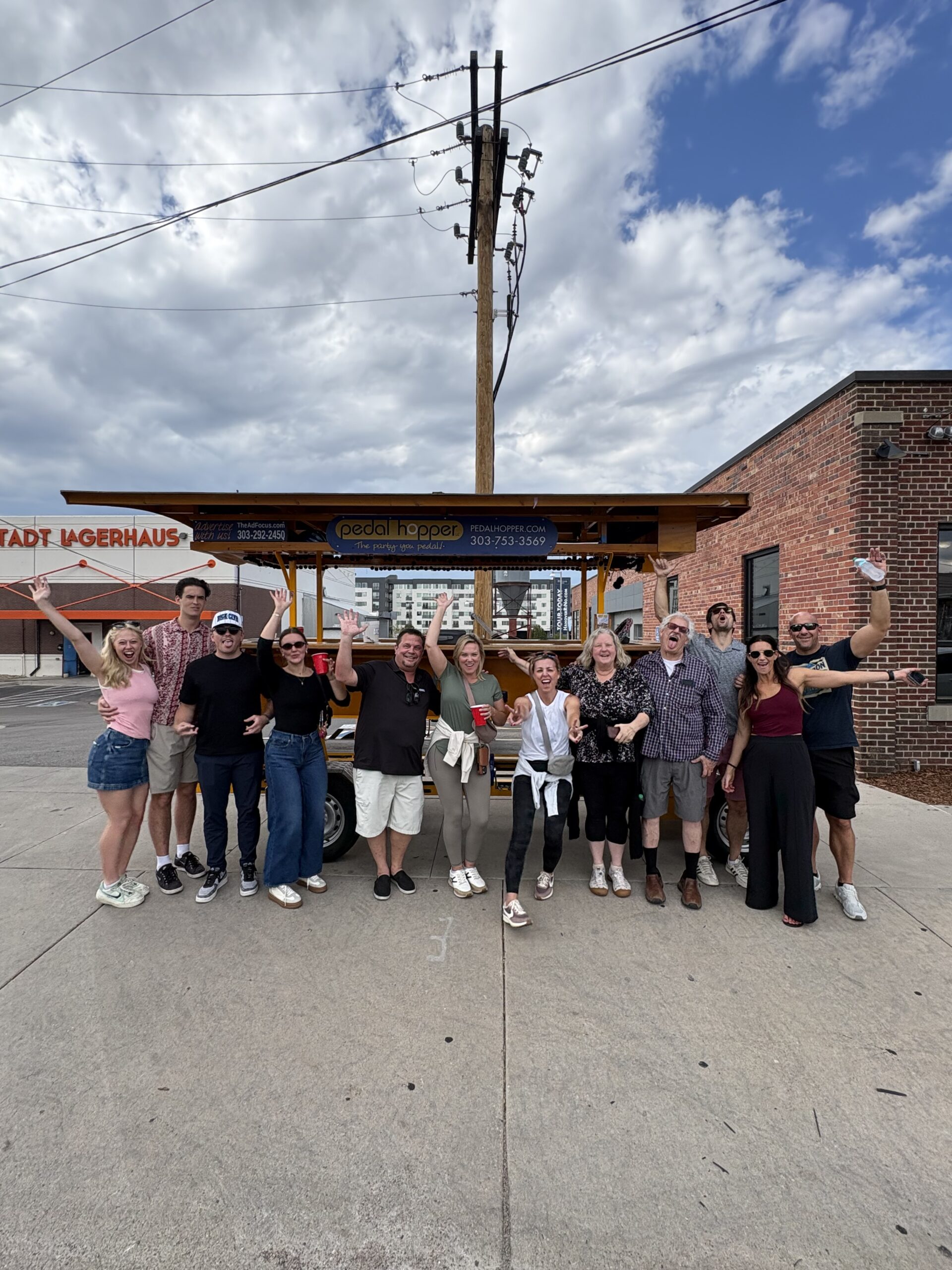 Colorado Urban Living agents in front of the Pedal Hopper at Bierstadt Lagerhaus in Denver